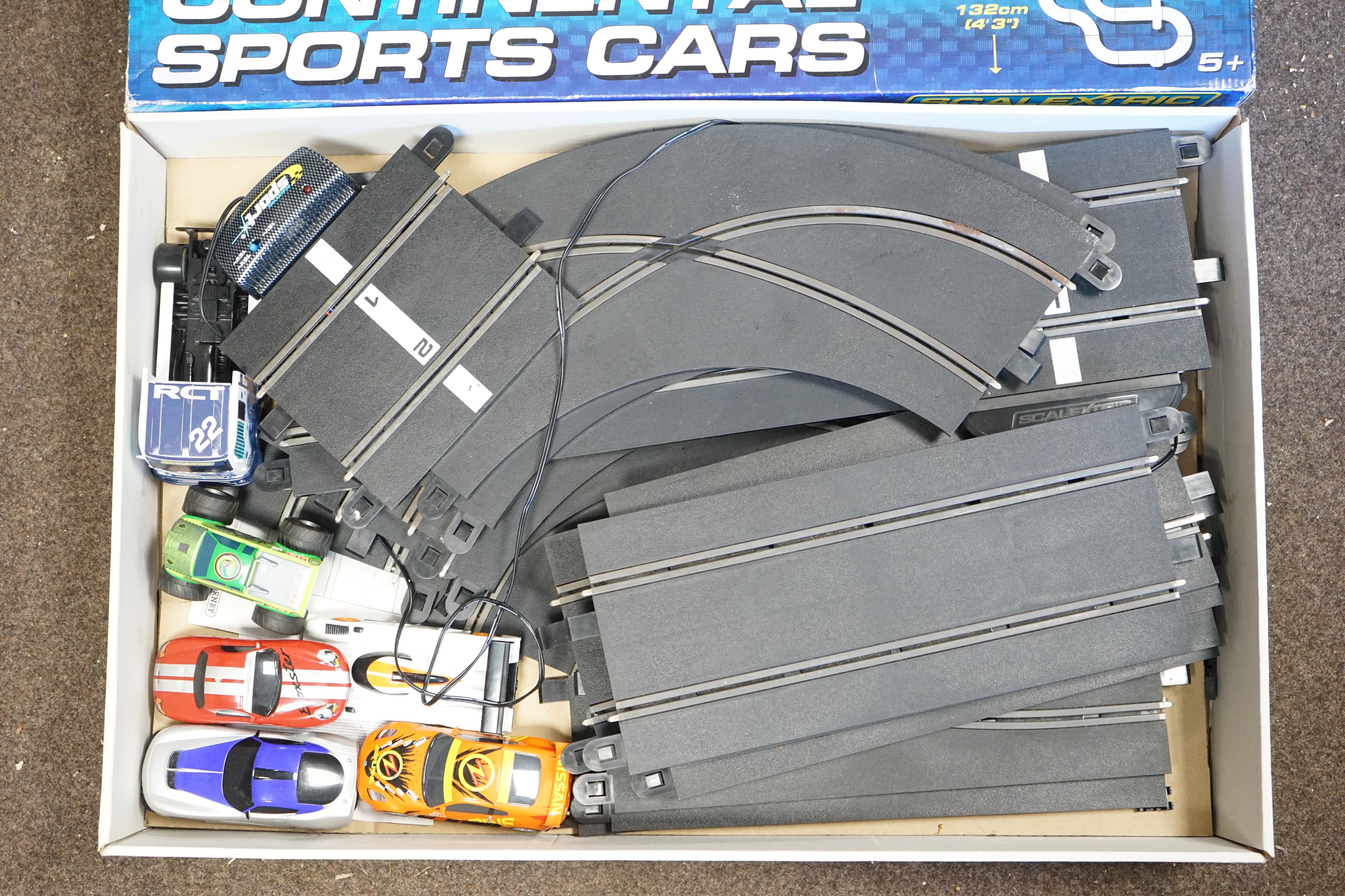 Two Scalextric sets; Le Mans 24 and Continental Sports Cars, together with a few additional cars (seven cars and an articulated tractor unit in total), plus a Track Extension Pack. Condition - fair, some accessories miss